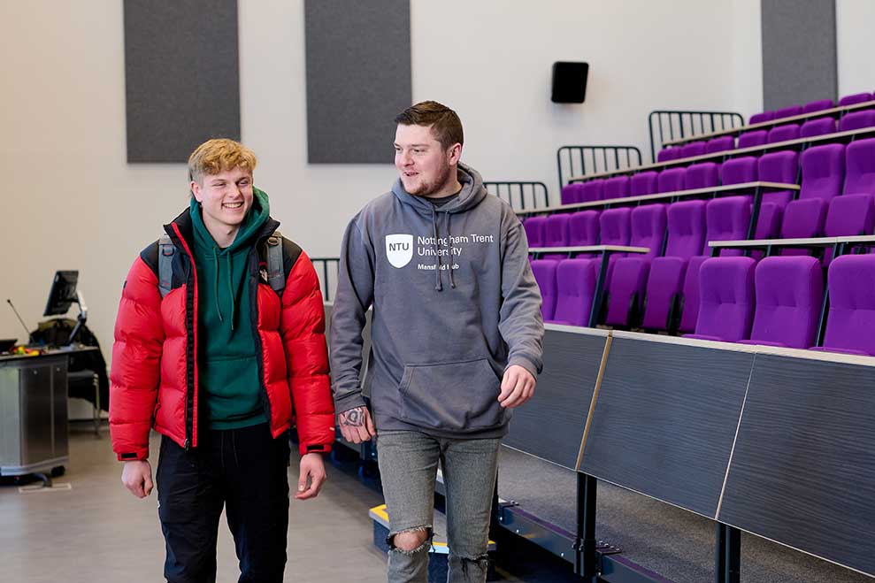 Two students in the NTU Mansfield lecture theatre